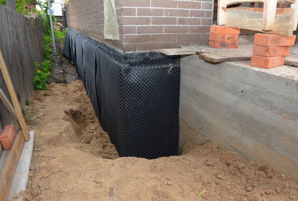 Happy homeowners after waterproofing job in Gwynedd